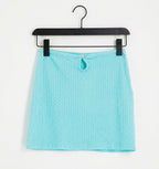 Textured mini skirt with front cut out in turquoise