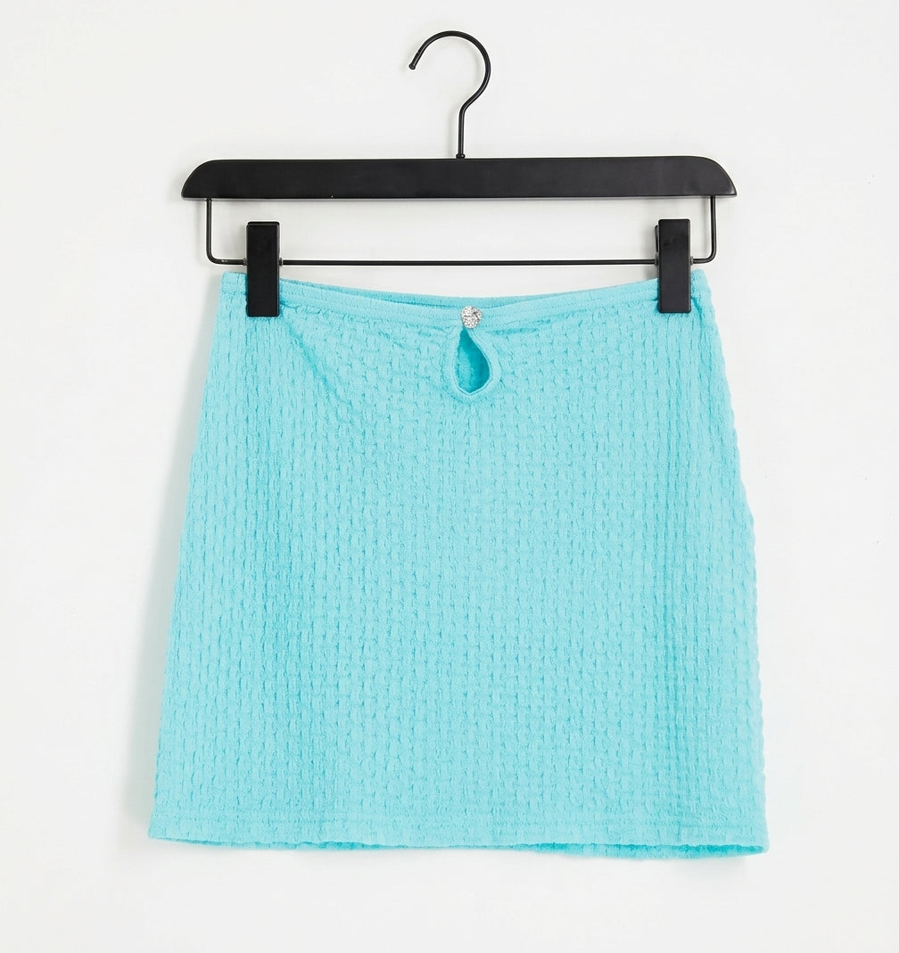 Textured mini skirt with front cut out in turquoise