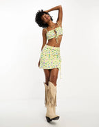 Exclusive tie side mini skirt co-ord in yellow ditsy floral
